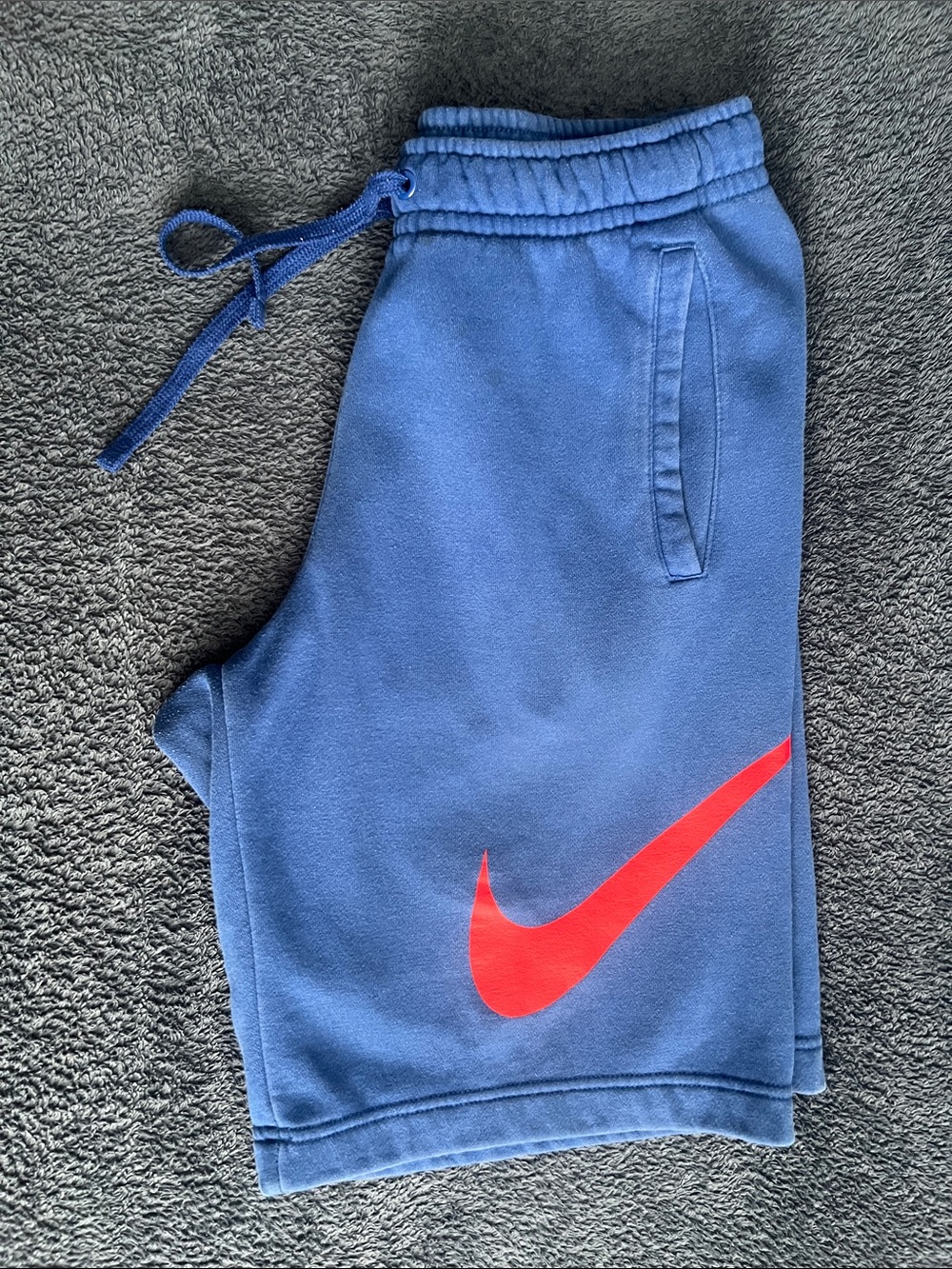 Nike Blue Athletic Shorts with Red Swoosh